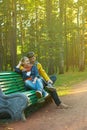 Young couple on a park bench Royalty Free Stock Photo