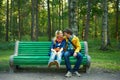 Young couple on a park bench Royalty Free Stock Photo