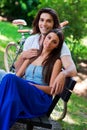 Young couple on the park bench Royalty Free Stock Photo