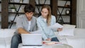 Young couple paying bills online in computer app Royalty Free Stock Photo