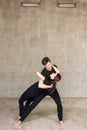 Young couple performing romantic dance.