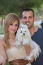 Young couple with pet maltese dog Royalty Free Stock Photo