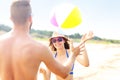 Young couple playing with a ball at the beach Royalty Free Stock Photo