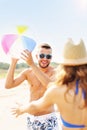 Young couple playing with a ball at the beach Royalty Free Stock Photo