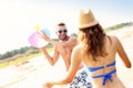 Young couple playing with a ball at the beach Royalty Free Stock Photo