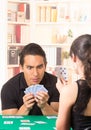 Young couple playing cards cuarenta