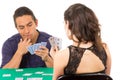 Young couple playing cards cuarenta