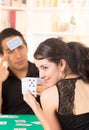 Young couple playing cards cuarenta