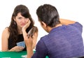 Young couple playing cards cuarenta