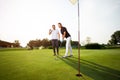 Young couple playing golf - Image Royalty Free Stock Photo