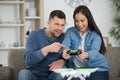 young couple playing video game together at home Royalty Free Stock Photo