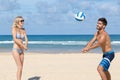 Young couple playing volley on beach Royalty Free Stock Photo