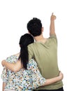 Young couple pointing at wall Royalty Free Stock Photo
