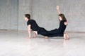 Young couple practices acrobatic balance. Royalty Free Stock Photo