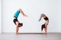 young couple Couple practicing acro yoga in white studio or gym. Healthy lifestyle