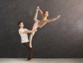 Young couple practicing acroyoga on mat together Royalty Free Stock Photo