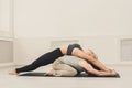 Young couple practicing acroyoga on mat together Royalty Free Stock Photo