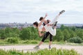 Young couple practicing street dance at a park wearing protective face masks Royalty Free Stock Photo