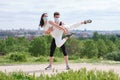 Young couple practicing street dance at a park wearing protective face masks Royalty Free Stock Photo