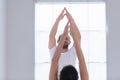 Young couple practicing yoga in a white room Royalty Free Stock Photo