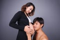 Young couple: pregnant mother and happy father on gray backgroun Royalty Free Stock Photo