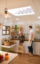 Young couple prepares cooking a breakfast in kitchen Royalty Free Stock Photo