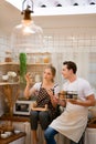 Young couple prepares cooking a breakfast in kitchen Royalty Free Stock Photo