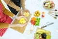 Young couple preparing a fruits smoothie in kitchen at home, healthy lifestyle. Royalty Free Stock Photo