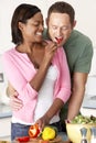 Young Couple Preparing Meal In Kitchen Royalty Free Stock Photo