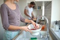 A young couple preparing a meal together. Kitchen, home, cooking, relationship Royalty Free Stock Photo