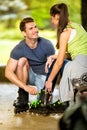 Young couple preparing for rollerblades Royalty Free Stock Photo
