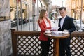 Young couple of professionals chatting during a coffee break