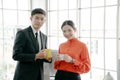 Young couple of professionals chatting during  coffee break Royalty Free Stock Photo