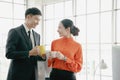 Young couple of professionals chatting during  coffee break Royalty Free Stock Photo