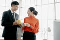 Young couple of professionals chatting during coffee break