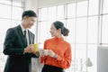 Young couple of professionals chatting during coffee break Royalty Free Stock Photo