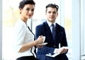 Young couple of professionals chatting during coffee break Royalty Free Stock Photo