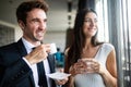 Young couple of professionals chatting during a coffee break Royalty Free Stock Photo