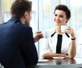 Young couple of professionals chatting during a coffeebreak Royalty Free Stock Photo