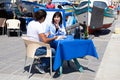 Young couple at a quayside restaurant, Marsaxlokk.