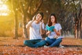 Young couple reading a book and listening music with headphone i Royalty Free Stock Photo