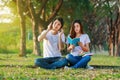 Young couple reading a book and listening music with headphone i Royalty Free Stock Photo