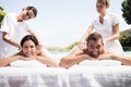 Young couple receiving a back massage from masseur Royalty Free Stock Photo