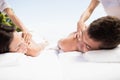 Young couple receiving a back massage from masseur Royalty Free Stock Photo