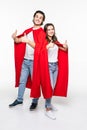 Young couple man and woman in red hero look hugging showing thumbup isolated on white background