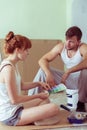 Young couple redecorating house