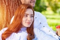 Young couple relaxing with coffee under tree Royalty Free Stock Photo