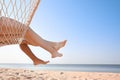 Young couple relaxing in hammock on beach Royalty Free Stock Photo