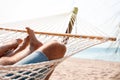 Young couple relaxing in hammock on beach Royalty Free Stock Photo
