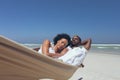 Young couple relaxing on hammock at beach Royalty Free Stock Photo